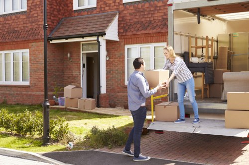 Removal van and moving boxes prepared for a Surrey house move
