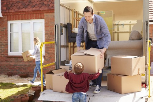 Local man with van loading furniture for a Surrey home move