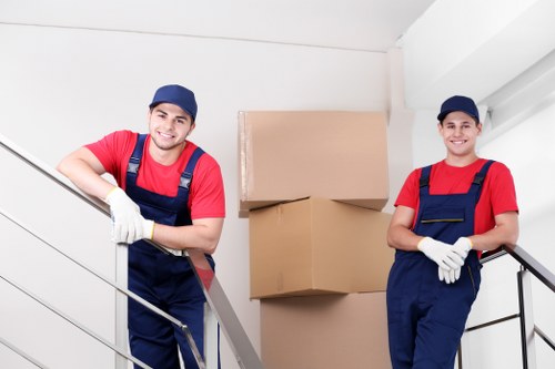 Student removals van loading boxes for a Surrey move