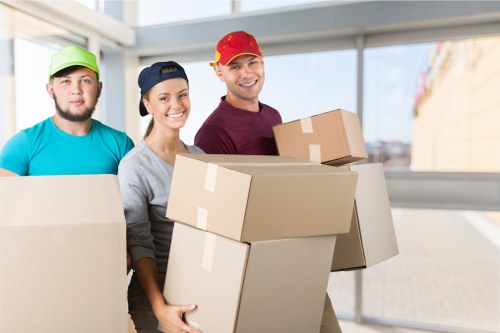 Packed moving boxes and household items ready for transport in Surrey