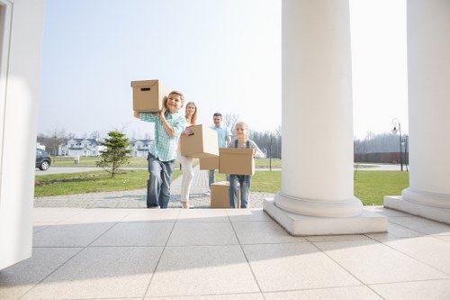 Business move planning with labelled boxes and office equipment
