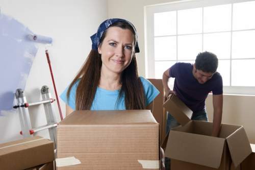 Boxes and furniture being unloaded into a new Surrey apartment