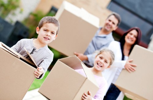Stacked cardboard boxes prepared for a flat move in Surrey
