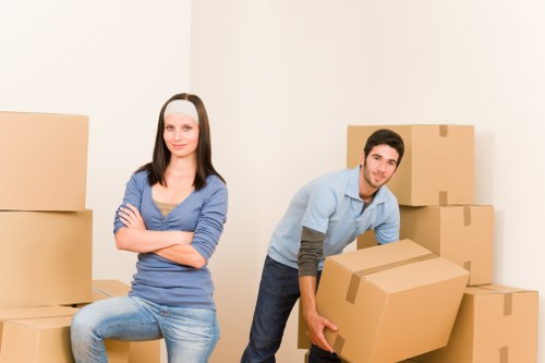 Furniture and boxes being loaded into a van for a Surrey move