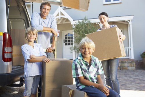 Packed boxes and furniture ready for a student move in Surrey