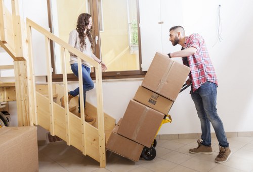 Driver loading furniture for a Surrey move using cubic-yard pricing
