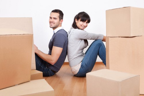 Professional movers handling furniture during a home removal in Surrey