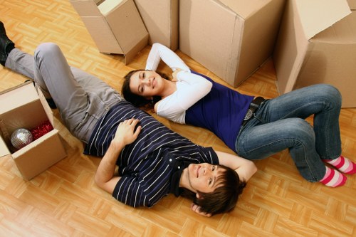 Careful lifting of household items from a flat in Surrey
